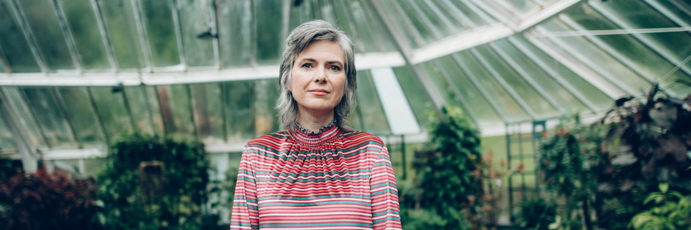 author emma hislop standing in front of a garden