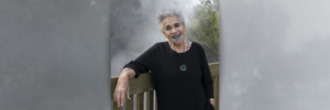 Banner image: Ngāhuia standing with arm draped over fence