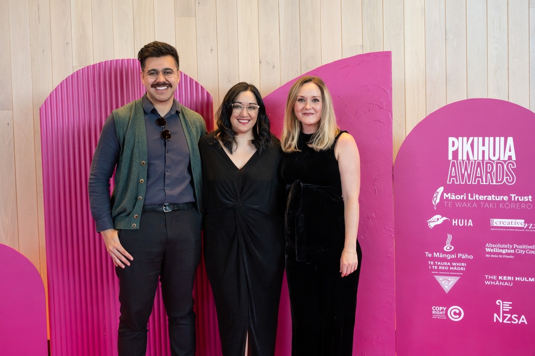 Three people in front of the Pikihuia Awards signage - Toni Wi centre.