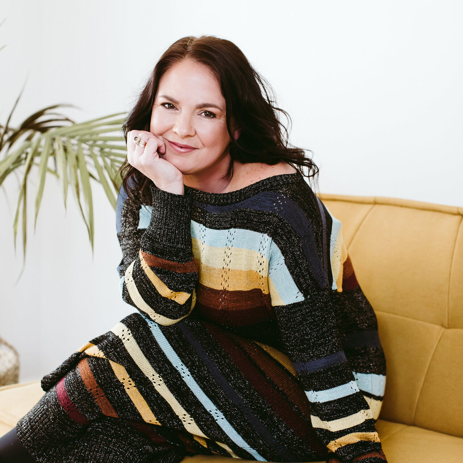 Jacqueline Bublitz on a yellow sofa