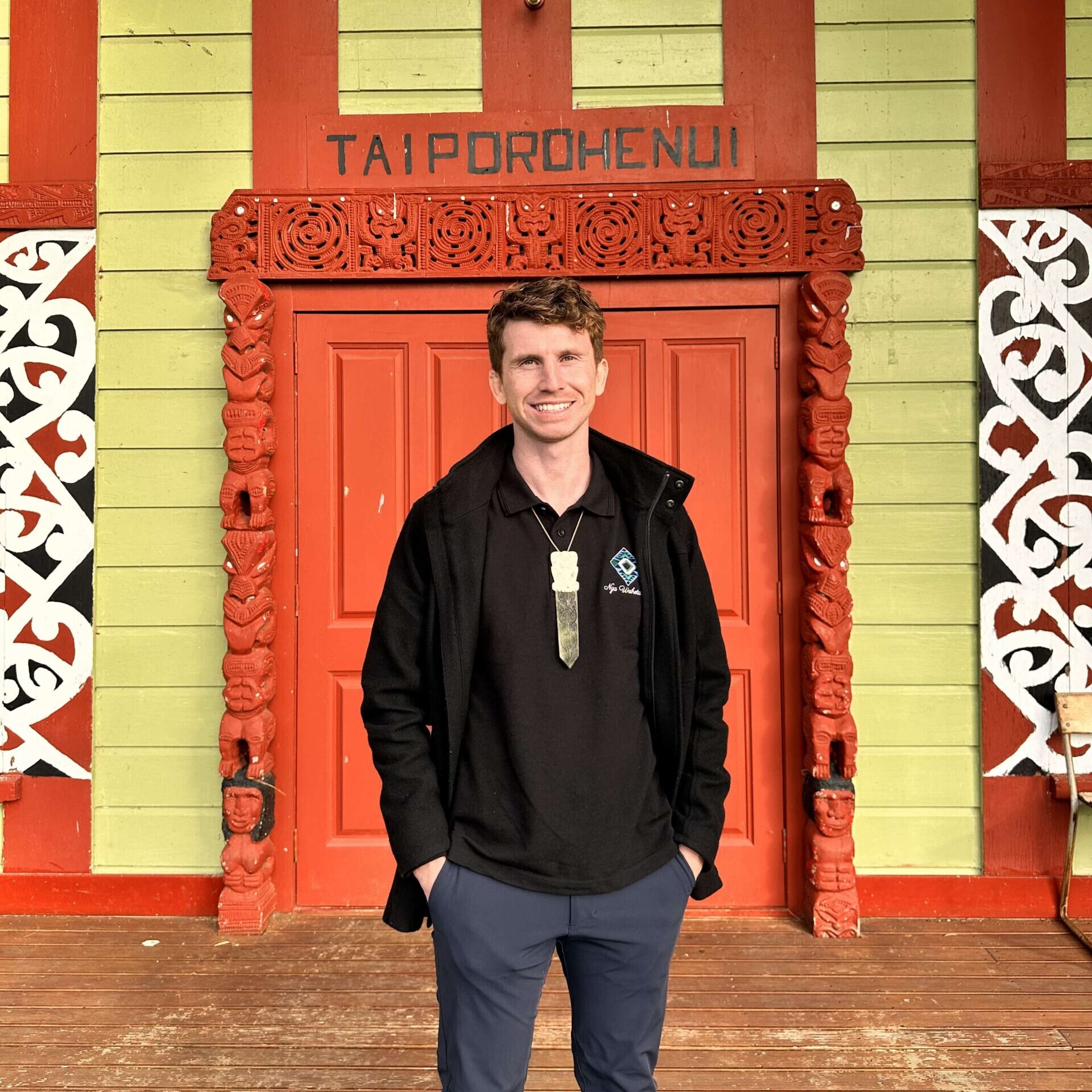 Airana Ngarewa standing in front of Taiporohenui wharenui